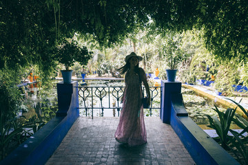 MARRAKECH, MOROCCO - July, 30th: Young girl at Majorelle Gardens landscape on November 30th 2017 in...