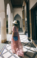 Caucasic girl with long dress and hat at Bay Palace