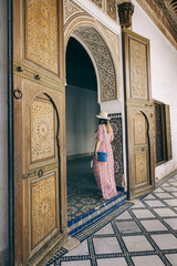 Caucasic girl with long dress and hat at Bay Palace