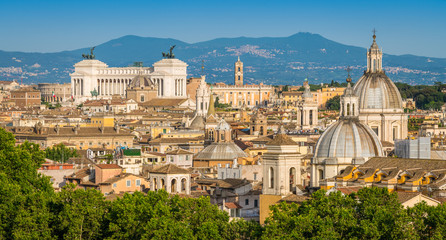Rome skyline as seen from Castel Sant'Angelo, with the dome of Saint Agnese Church, the Campidoglio and the Altare della Patria monument. - obrazy, fototapety, plakaty