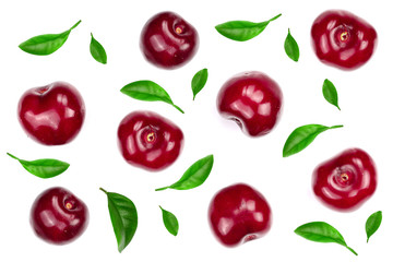 Sweet red cherries decorated with leaves isolated on white background with copy space for your text. Top view. Flat lay