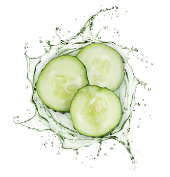 Cucumber slices rotate in splashes of juice on white background