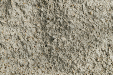 Wet sand after the rain texture background. Top view photo.