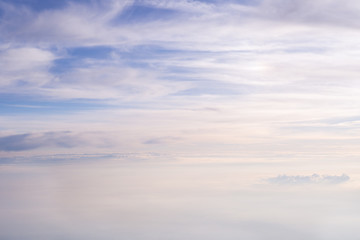 Fototapeta na wymiar Skyline View above the Clouds from Airplane
