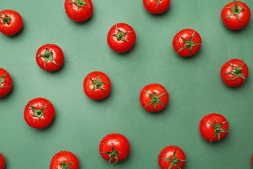 Flat lay composition with ripe tomatoes on color background