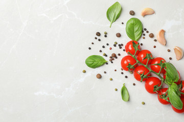 Flat lay composition with tomatoes, pepper and basil on light background
