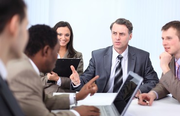 businessman holds working meeting with employees