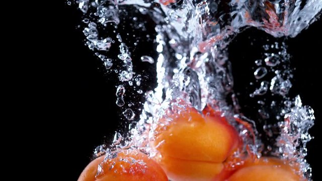 Apricot water splash in super slow motion, shot with high speed camera Phantom VEO 4K , 1000fps.