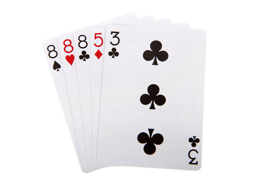 Playing cards, three of a kind. Three cards with the same rank or value. Ties are broken by the highest value. Isolated on white background.