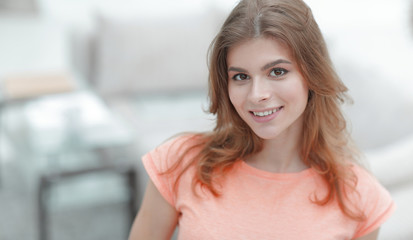 closeup portrait of a young woman on blurred background.