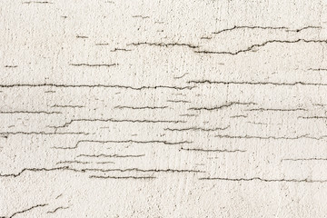 Texture of white dirty cracked wall. Small straight cracks. Direct fracture on painted surface....