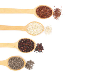 Black red white quinoa and chia seeds in wooden spoon isolated on white background with copy space for your text