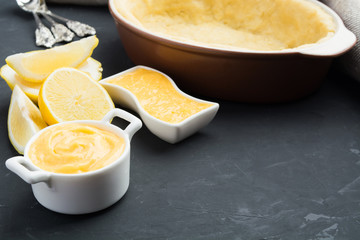 White jar with lemin curd ready for cooking of cake