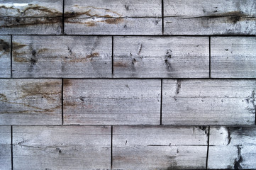 Wooden texture, old boards with a rough surface, horizontal rows with transverse cuts.