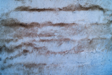 Stone texture, light surface with abstract spots and stripes of brown color.