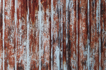 Metal texture, a surface with vertical strips with traces of corrosion.