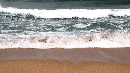 Fototapeta na wymiar White sand and waves.
