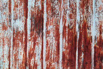 The surface of the old metal sheet with rust and paint remains, metal texture.