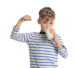 Adorable little boy with glass of milk on white background