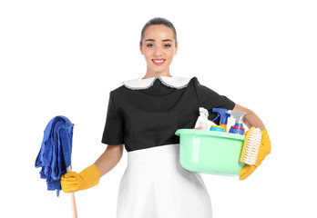 Young chambermaid holding mop and plastic basin with detergents on white background