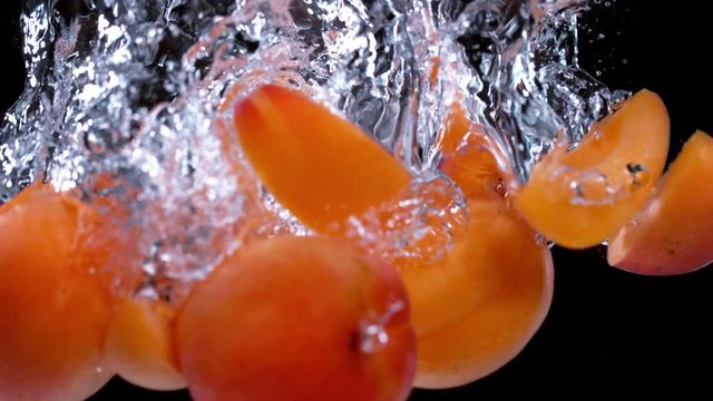 Apricot water splash in super slow motion, shot with high speed camera Phantom VEO 4K , 1000fps.