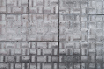Surface of gray square tiles, stone texture.