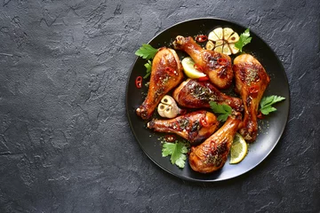  Roasted spicy chicken legs.Top view with copy space. © lilechka75