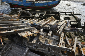 Broken wooden boats in the river