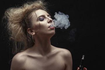 woman smoking electronic cigarette