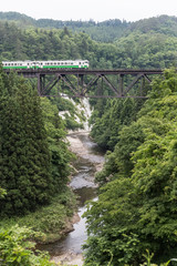 Fototapeta na wymiar Tadami railway line and Tadami River in summer season at Fukushima prefecture.