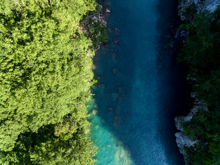 Top drone view at blue mountain river