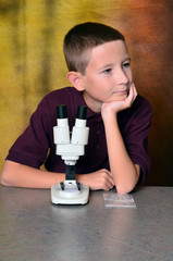 Young Boy Using a Microscope