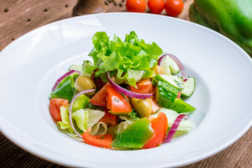 Vegetable salad with tomatoes and cucumbers