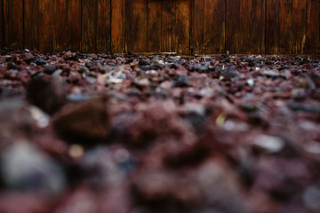 Details of brown wooden house with window and curtains