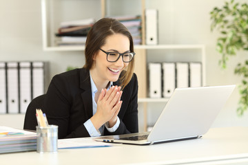Happy office worker receiving good online news