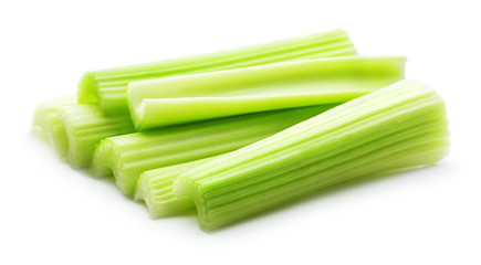 heap of green celery sticks isolated on white background
