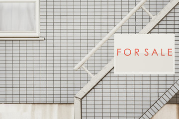 Sale Real Estate Sign in Front of house