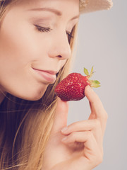 Young woman with fresh strawberry