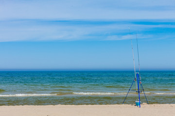 Fishing rod left alone on sea shore