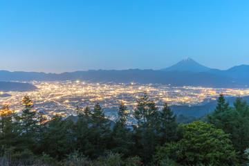Mt.Fuji and Kofu city with sunrise sky seen from Mt. Amariyama view point.