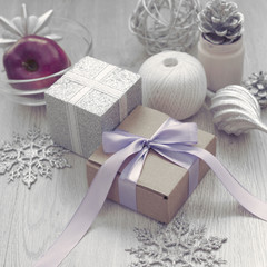 Christmas composition with gift box with satin ribbon bow materials for decorating Christmas toy bump.