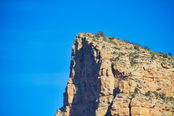 The red rocks of Sedona with plenty of blue sky that can be used as copy space.