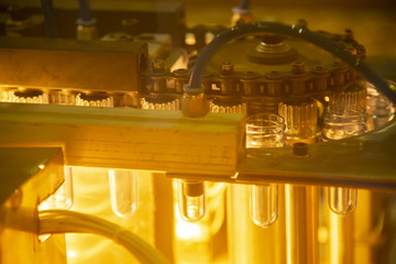 The preform shape of plastic bottle product in the heater for preheating process.Plastic bottle container manufacturing process.