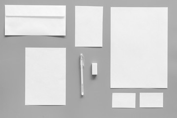 Mockup template for branding identity. White stationery on grey background top view. Pattern