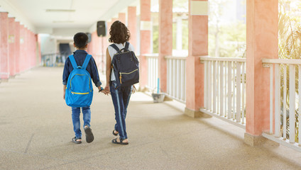 asian children holding hand together going to the school.education and people concept.back to school
