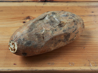 Roasted sweet potatoes on wooden table