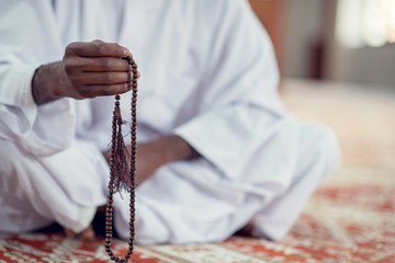 African Muslim Man Making Traditional Prayer To God While Wearing Dishdasha