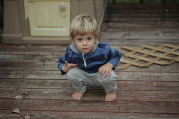 Photo of adorable young happy boy looking at camera.