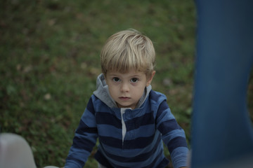 Photo of adorable young happy boy looking at camera.