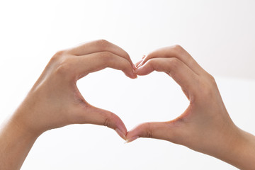 Fototapeta premium Hands shaping a heart. For love related concepts.